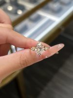 Oval Cut Lab Grown Diamond Three-Stone Engagement Ring in 18K Yellow Gold