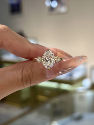 Oval Cut Lab Grown Diamond Three-Stone Engagement Ring in 18K Yellow Gold