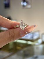 Oval Cut Lab Grown Diamond Three-Stone Engagement Ring in 18K Yellow Gold