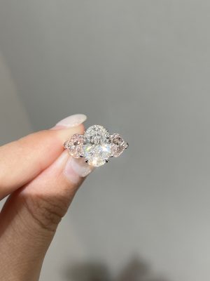 3CTW Oval Cut With Heart Cut Fancy Pink Lab Grown Diamond Three Stone Engagement Ring